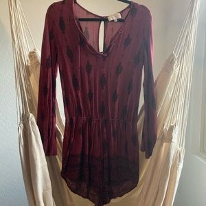 maroon romper with black pattern